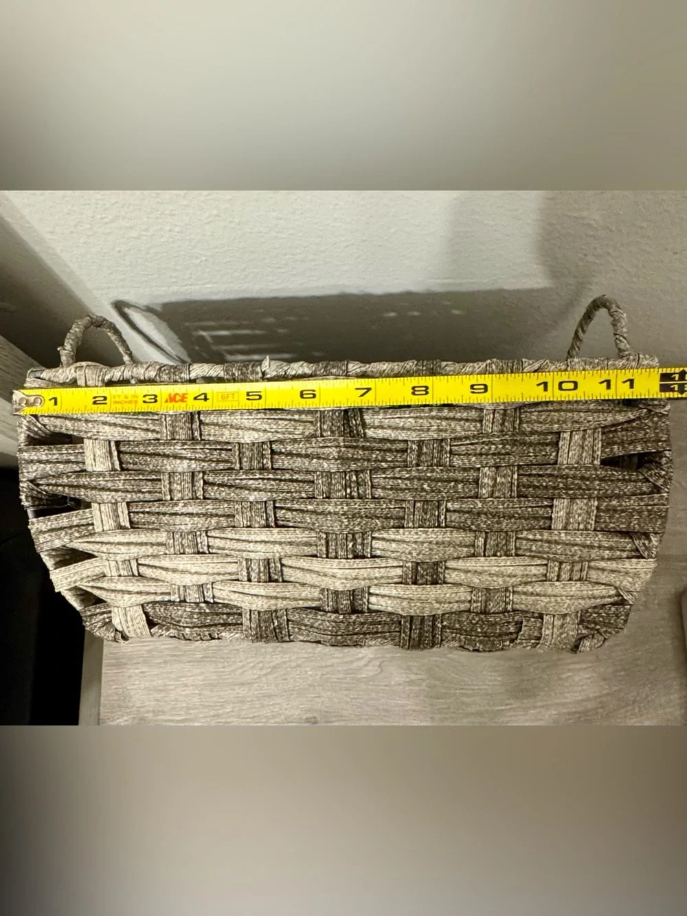 Allen +Roth . This small, grey decorative basket by allen + roth is made of poly